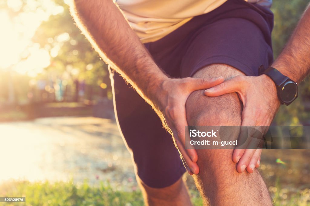 Jogging Injury Always warm-up before jogging or injury occurs... Pain Stock Photo