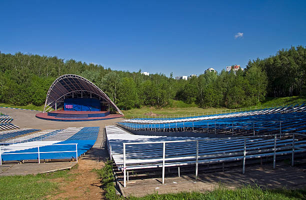 Open air stage with multiple rows of seats, no people