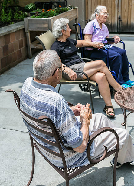 istock Caregiver Daughter Sitting With Elderly Parents 503437009