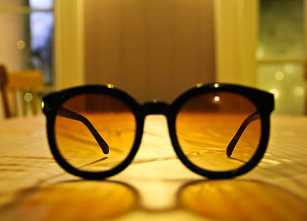 istock sunglasses on the table in dinning room 503439197