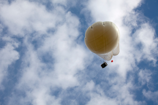 Part of a five year long NASA national air quality project, a tethered balloon and air testing payload ascends into the Golden, Colorado skies and relays meteorological (barometric pressure,wind speed,etc), pollution and emissions data (NO2, ozone, etc.) to a mobile ground station located on the State of Colorado property on the South Table Mountain.