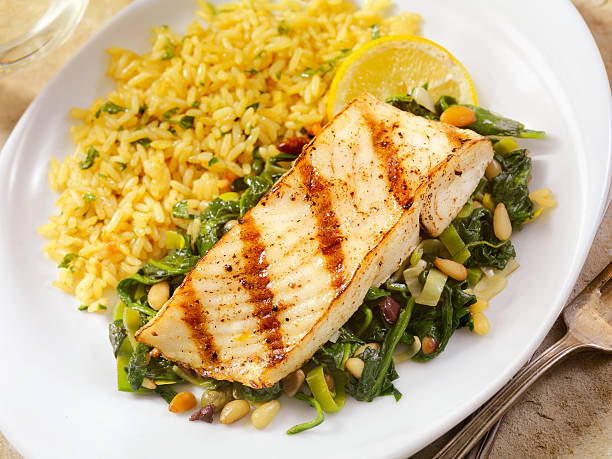 istock Grilled Halibut with Spinach, leeks and Rice 503452926