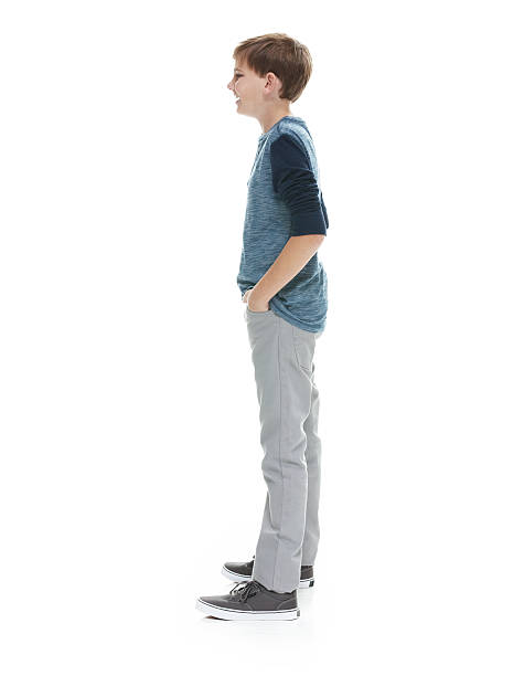 istock Smiling little boy standing and looking away 503453638