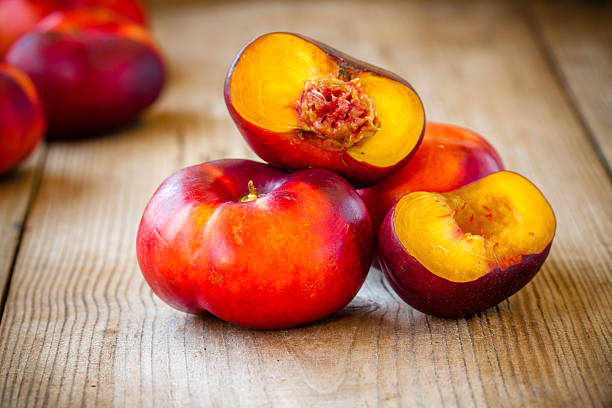 istock fresh flat nectarines on a wooden background 503454049