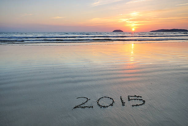 istock Year 2015 written on sand at Sunset 503454269
