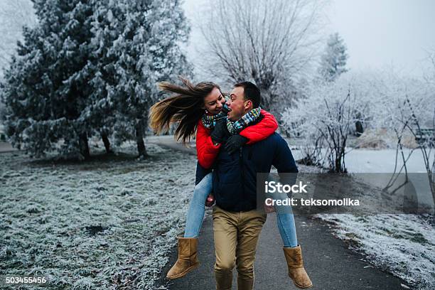 Man Carries His Girlfriend On Back Stock Photo - Download Image Now - Activity, Adult, Branch - Plant Part