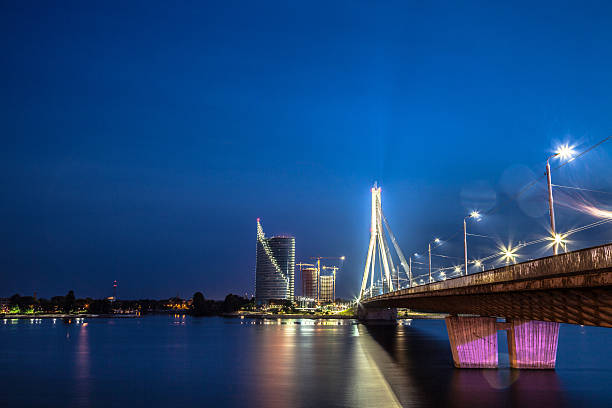 istock Riga nightview of riverbank and modern bridge 503455586