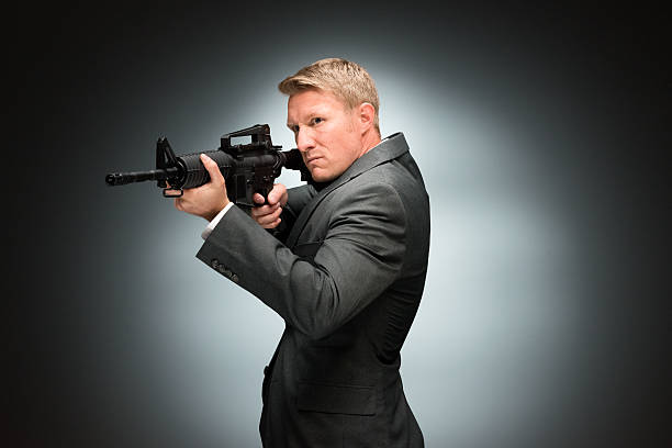 istock Businessman aiming with rifle 503456146