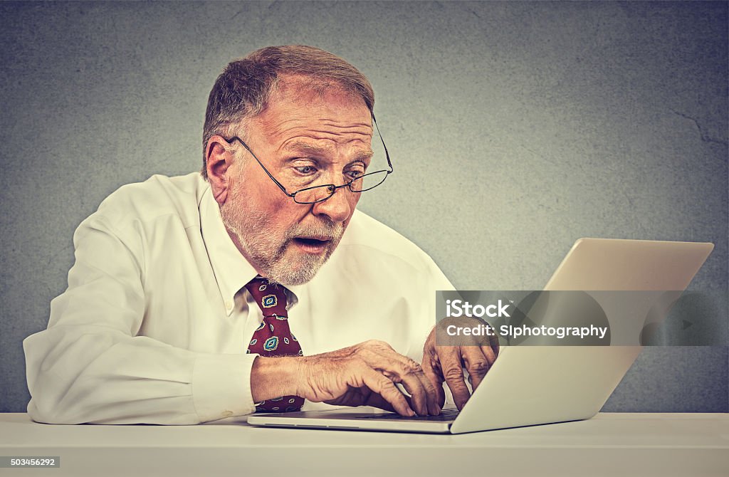 Senior Confused Using Computer Confused Surprised Senior Man Using Pc Laptop Computer Stock Photo ...
