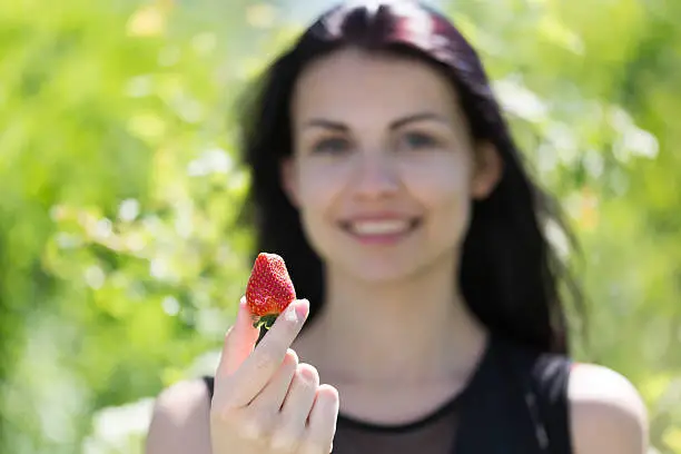 Girl with strawberry