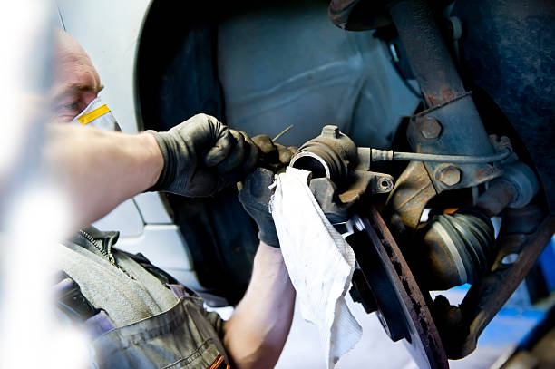 istock Mechanic Adjusting Brakes 503458946