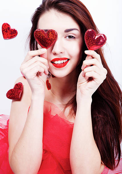 istock Brunette girl with red hearts 503459236