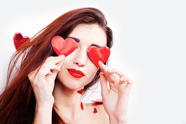 istock Brunette girl with red hearts 503459328