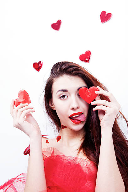 istock Brunette girl with red hearts 503459448