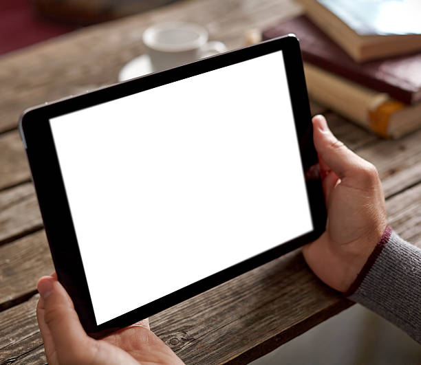istock Man shows screen of tablet in his hands 503460496