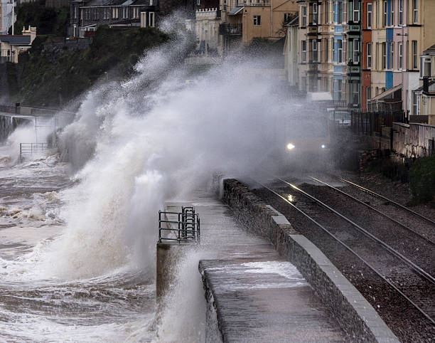 istock Wave breaking over local train at Dawlish 503460938