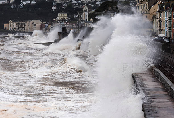 Breaking waves Dawlish particularly against reconstructed part of sea wall stock photo
