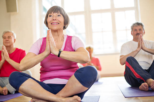 istock Happy seniors doing yoga 503462530
