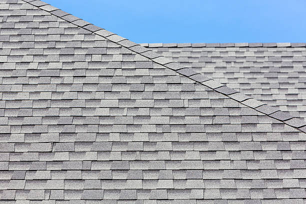 Close up of new rubber roof tiles Close up of new rubber roof tiles with blue skybackground. house residential structure roof rooftiles stock pictures, royalty-free photos & images