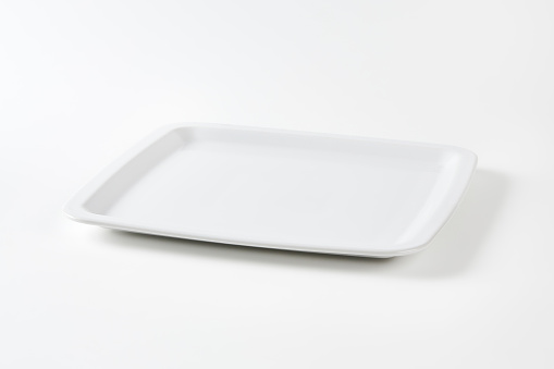 Square white porcelain dinner plate with raised narrow rim