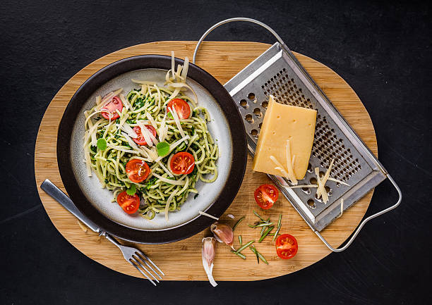 istock Pasta with spinach, tomatoes and cheese on plate 503465146