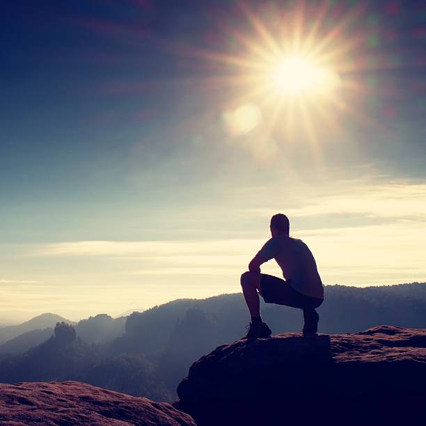 istock Freedom hiker sit up misty valley and enjoy fall rocks 503468024