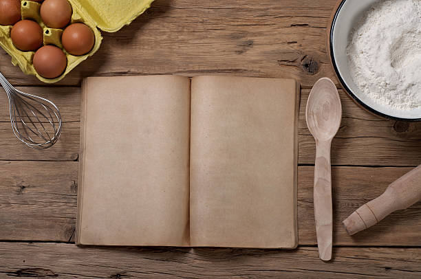 istock Cookery book with blank pages with ingredients for baking 503484668