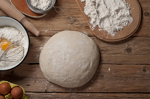 istock Fresh dough on a wooden table in a bakery 503484800