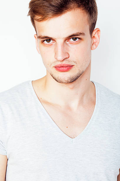 istock young handsome man on white background gesturing, pointing, posing emotional 503485386