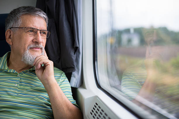 Senior man enjoying a train travel