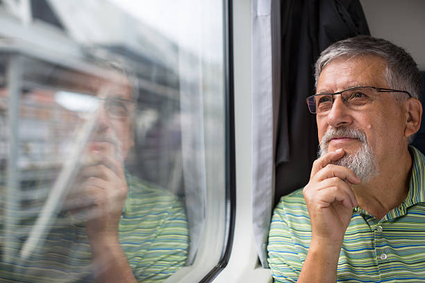 istock Senior man enjoying a train travel 503485830