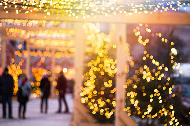 Christmas street lights decorations in european city stock photo