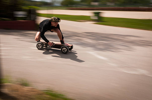 Riding fast on an electric skateboard stock photo