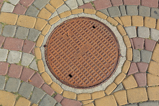 Münster, Germany, October 18, 2022 - Sewer cover of the university city of Münster