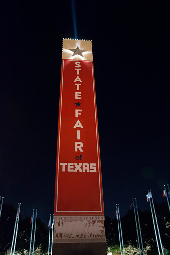 Dallas, Texas USA - October 11, 2015: Texas State Fair sign at night in front of the entrance gate of the fair in Dallas