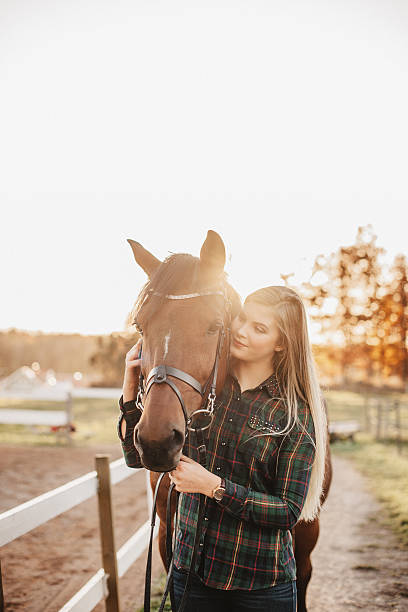 istock Young woman and her horse 503488016