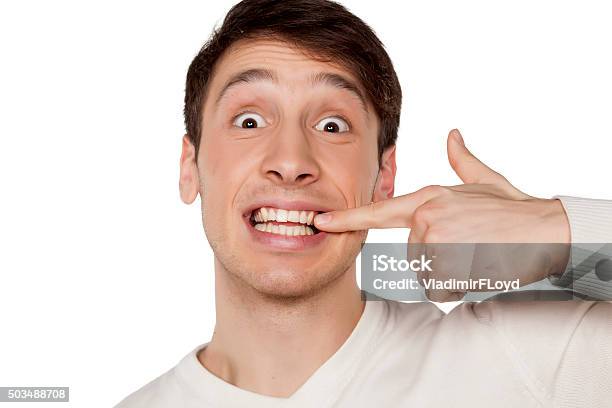 Teeth Pointing Out Pointing At His Teeth Stock Photo - Download Image Now - Adult, Adults ...