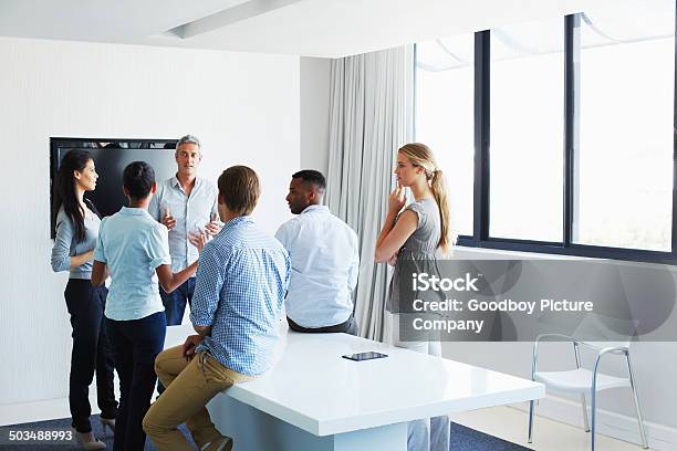 Hes Got The Team Together Stock Photo - Download Image Now - Business Casual, Meeting, Mixed Age Range