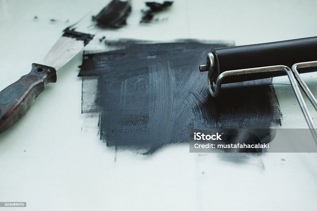 Black Printmaking Ink With Roller And Spatula Stock Photo