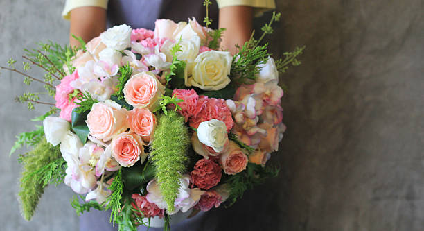 istock Florist holding bouquet 503490225