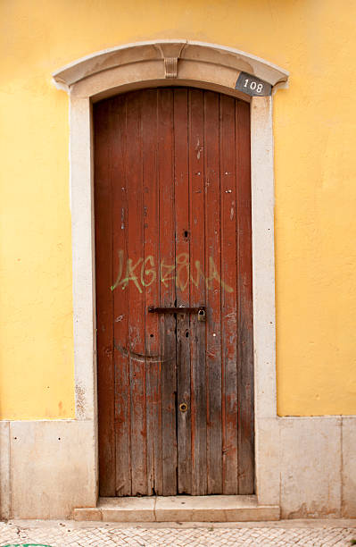 istock Brown door with illegal grafitti 503492499