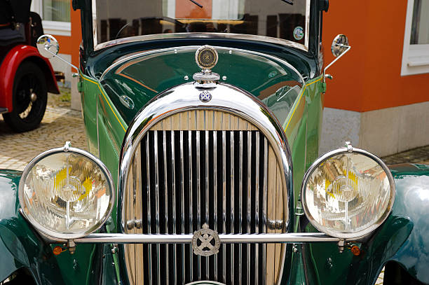 Landsberg, Germany - July 12, 2014: A public oldtimer rally, named Herkomer-Konkurrenz, is organized for at least 80 years old classic cars in Bavarian city Landsberg. Approx. 75 veteran cars participate at this event with their unidentified drivers and passengers. The route runs on public streets through the rural landscape of Bavaria. Here you see the front view of Hotchkiss AM 80, built at year 1930.