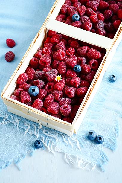 istock Fresh raspberries in basket 503506394