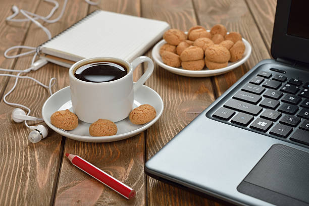 istock Cup of coffee and a laptop 503507572
