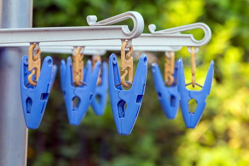 Plastic clothespins for laundry used (blue color)
