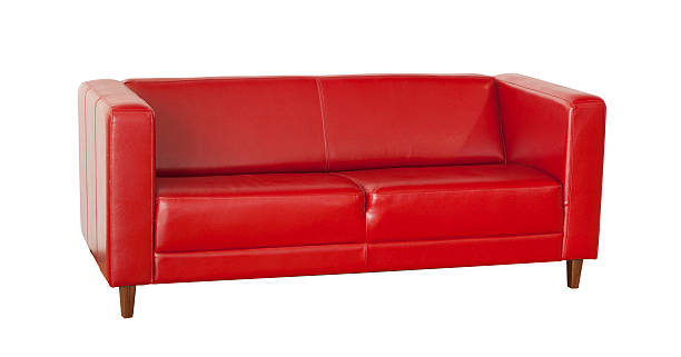 istock Elegant red leather sofa isolated on white background 503509912