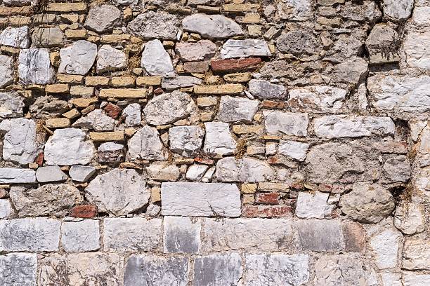 istock old abstract texture of a destroyed stone wall 503512520
