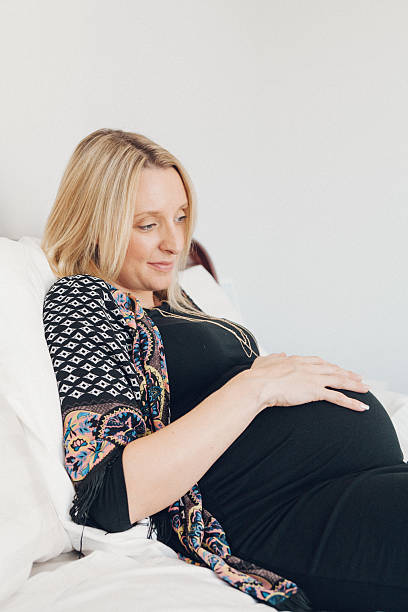 istock Pregnant woman propped up by pillows 503512714