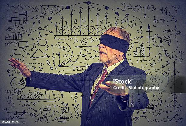 Blindfolded Senior Business Man Walking Through Social Media Data Stock Photo - Download Image Now