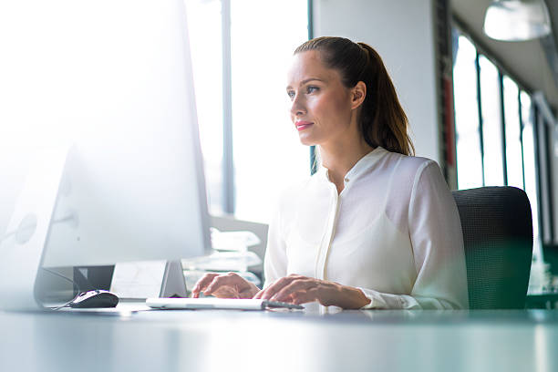 istock Businesswoman using computer at desk in office 503520074